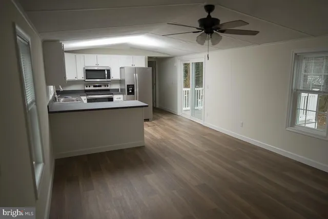 a kitchen with stainless steel appliances a stove and a refrigerator