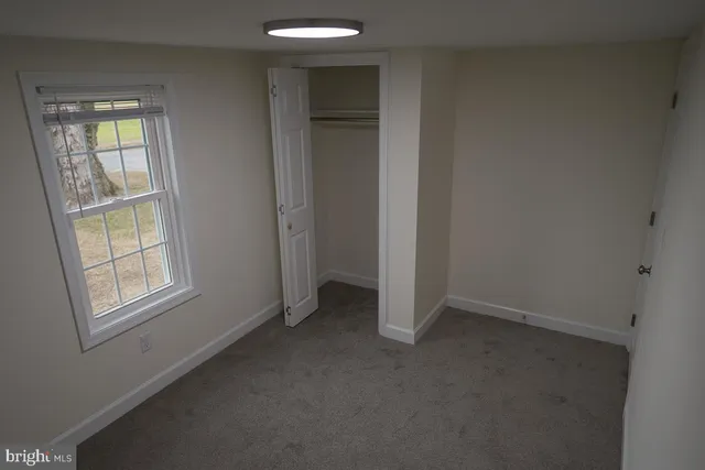 an empty room that has a window