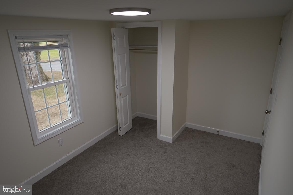 16449 Polk Road Bridgeville, DE 19933 - Photo 7 of 22 an empty room that has a window