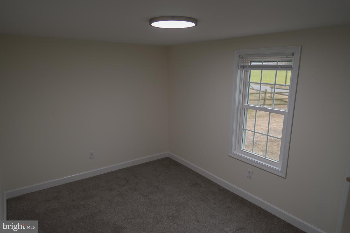 16449 Polk Road Bridgeville, DE 19933 - Photo 9 of 22 an empty room with a window