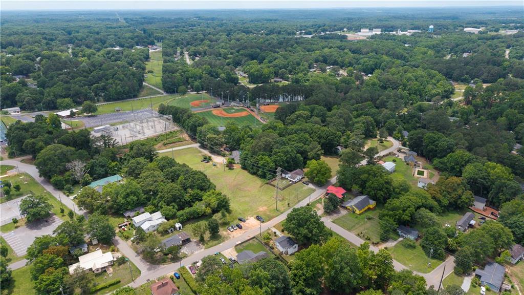 156 Pine Avenue Commerce, GA 30529 - Photo 31 of 35 an aerial view of residential houses with outdoor space and trees