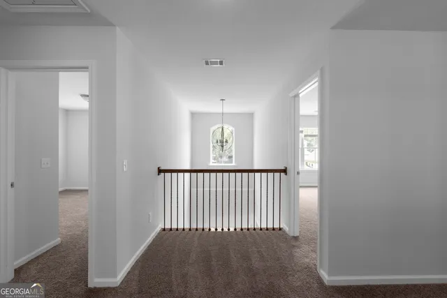 a view of a hallway with windows