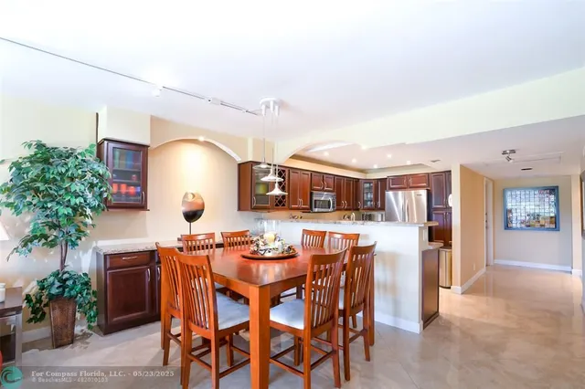 a dining room with furniture and window