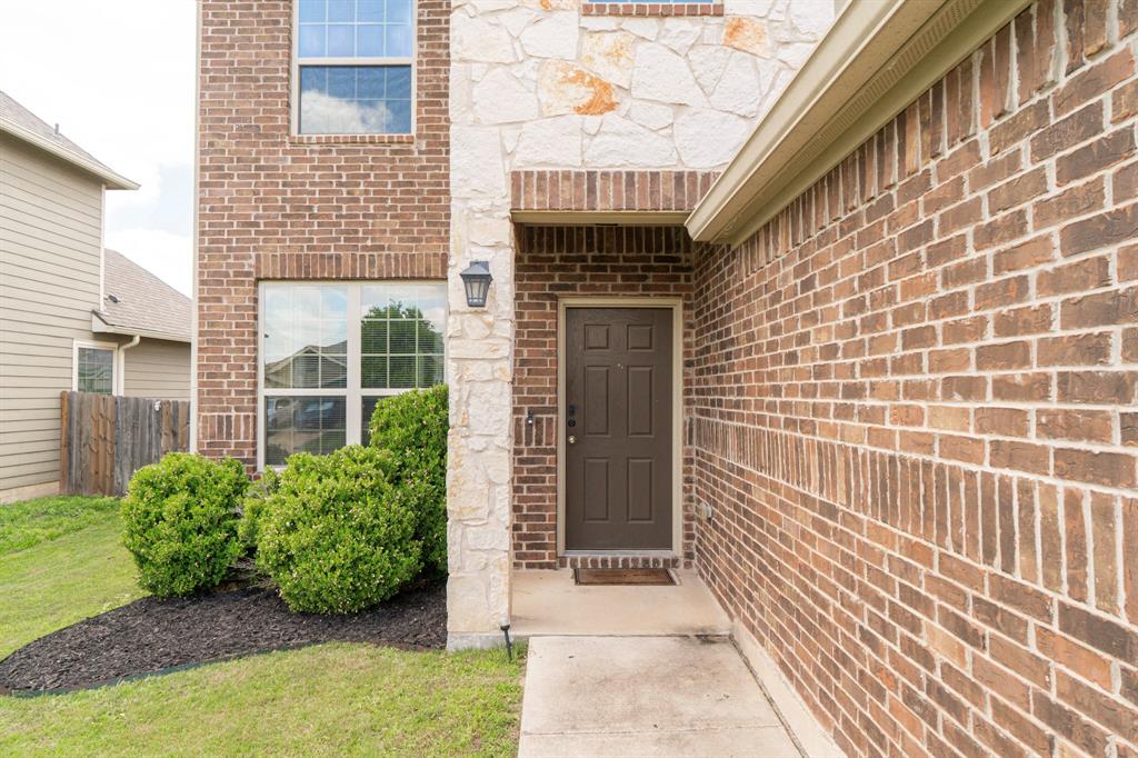 2716 Beutel Road Lorena, TX 76655 - Photo 3 of 39 a view of a brick house with a large window