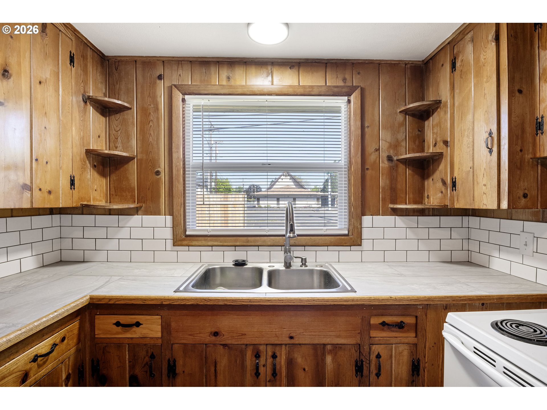 1008 Coburg Road Eugene, OR 97401 - Photo 10 of 46 a sink a mirror a window and a sink
