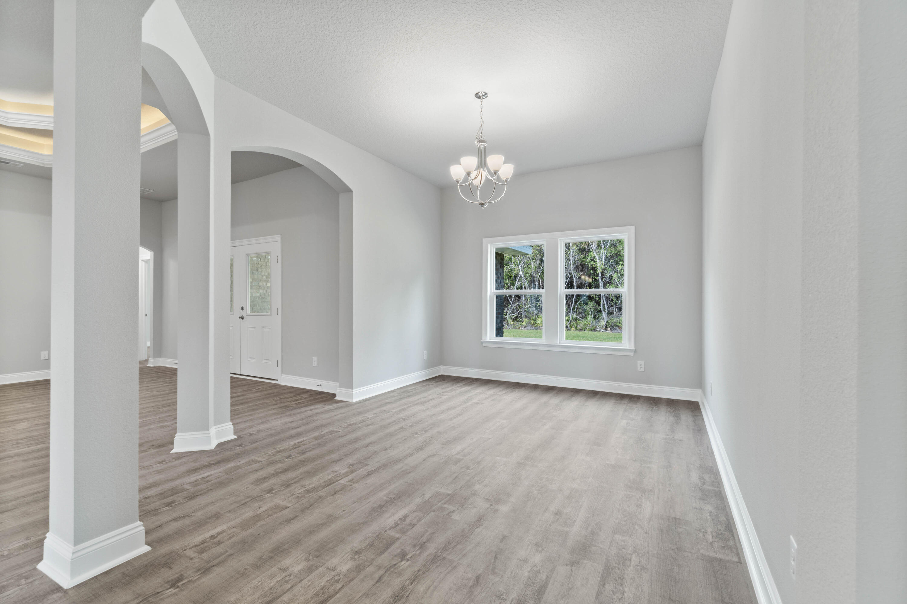 3548 Bob Tolbert Road Navarre, FL 32566 - Photo 17 of 47 wooden floor in an empty room with a window
