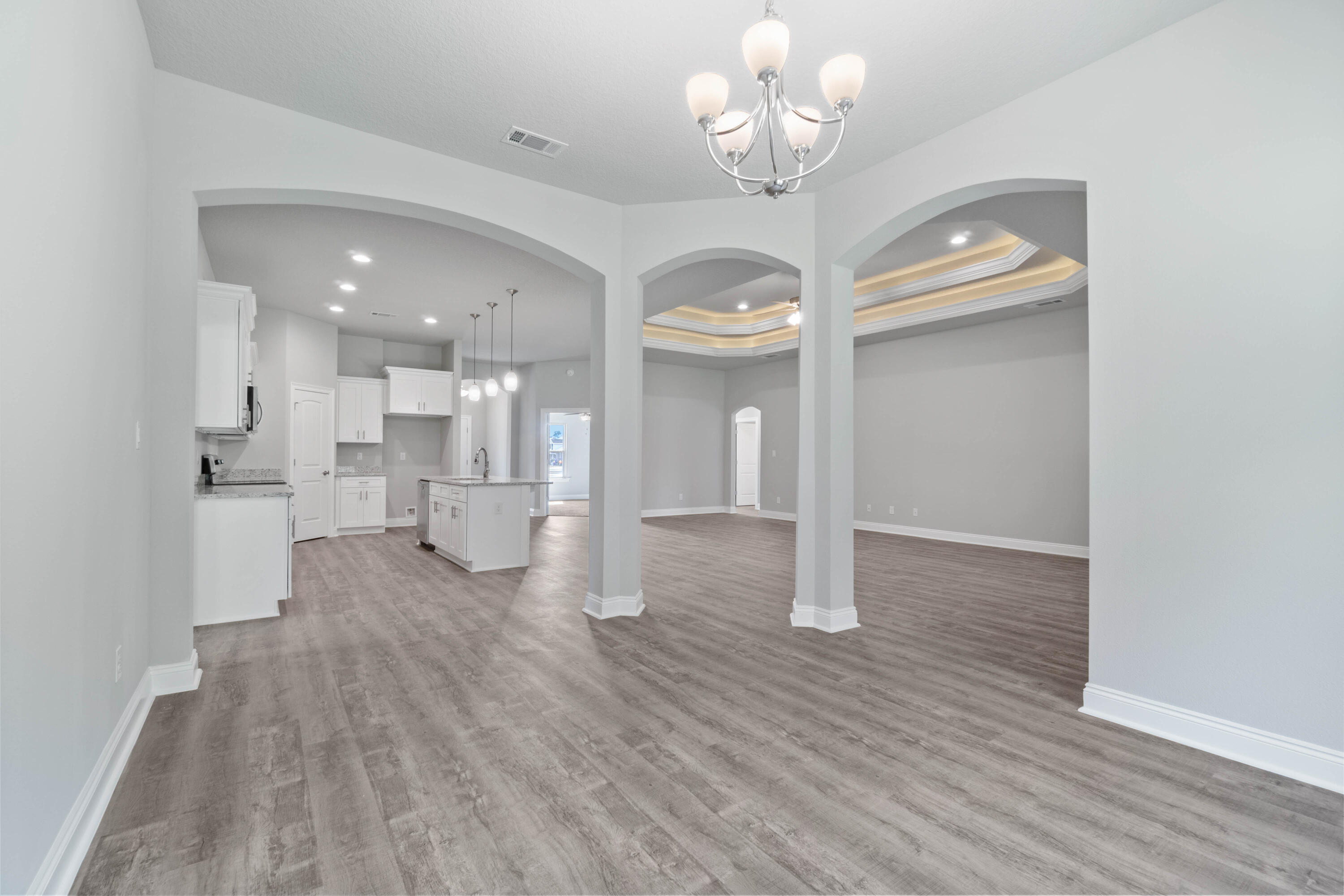 3548 Bob Tolbert Road Navarre, FL 32566 - Photo 18 of 47 a view of a house with wooden floor