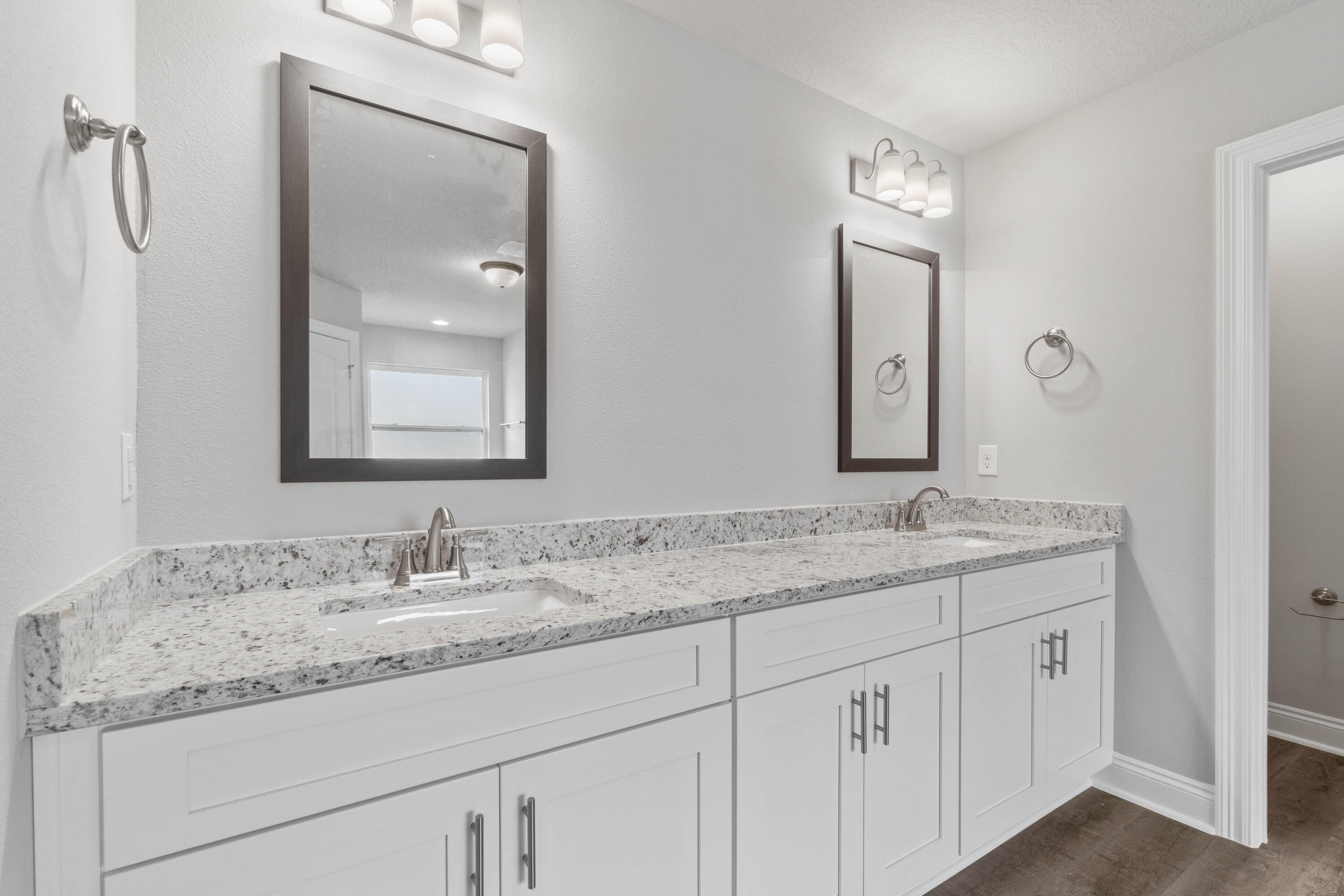 3548 Bob Tolbert Road Navarre, FL 32566 - Photo 23 of 47 a bathroom with a granite countertop sink double and mirror