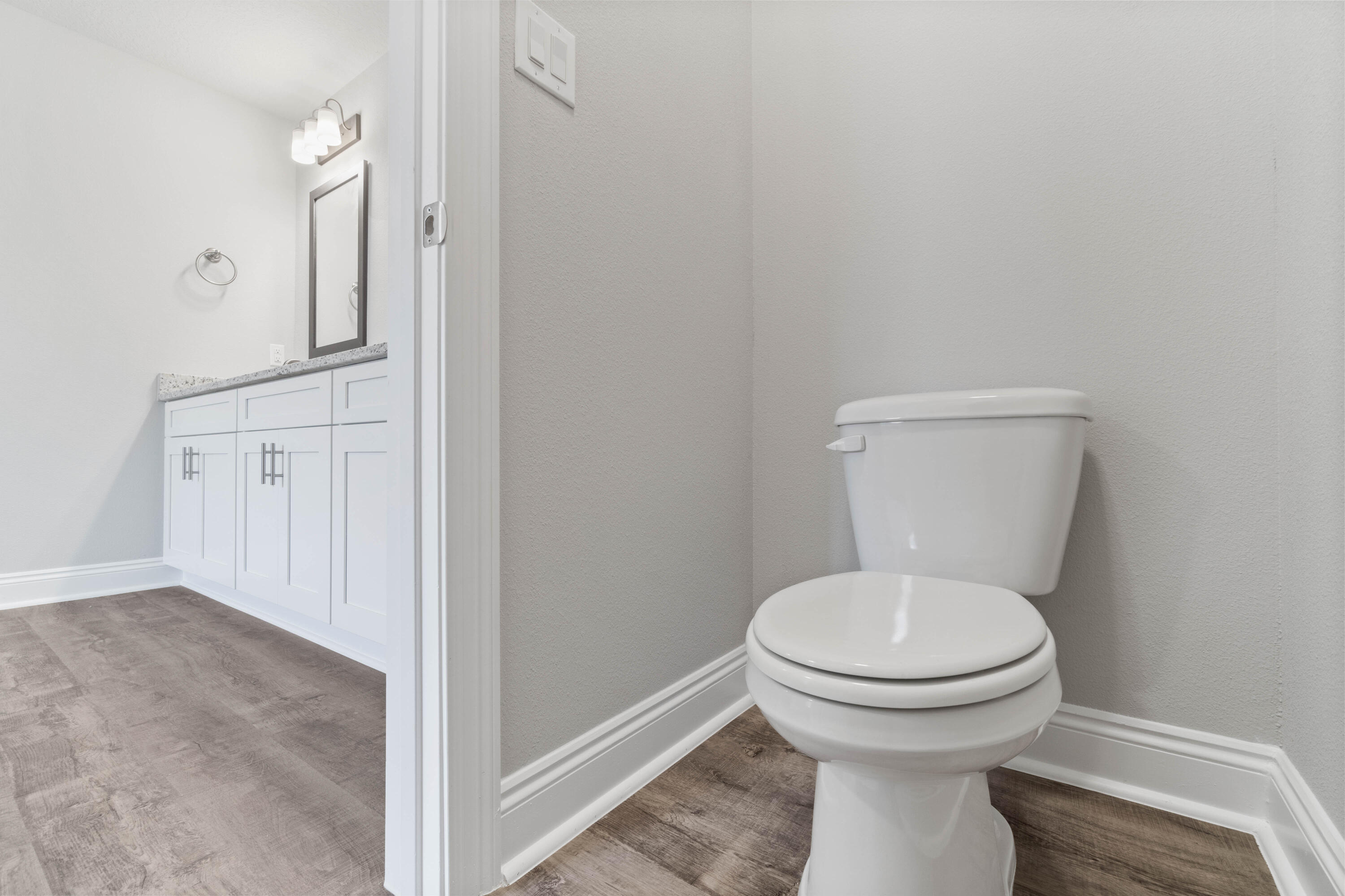 3548 Bob Tolbert Road Navarre, FL 32566 - Photo 26 of 47 a bathroom with a toilet and a sink