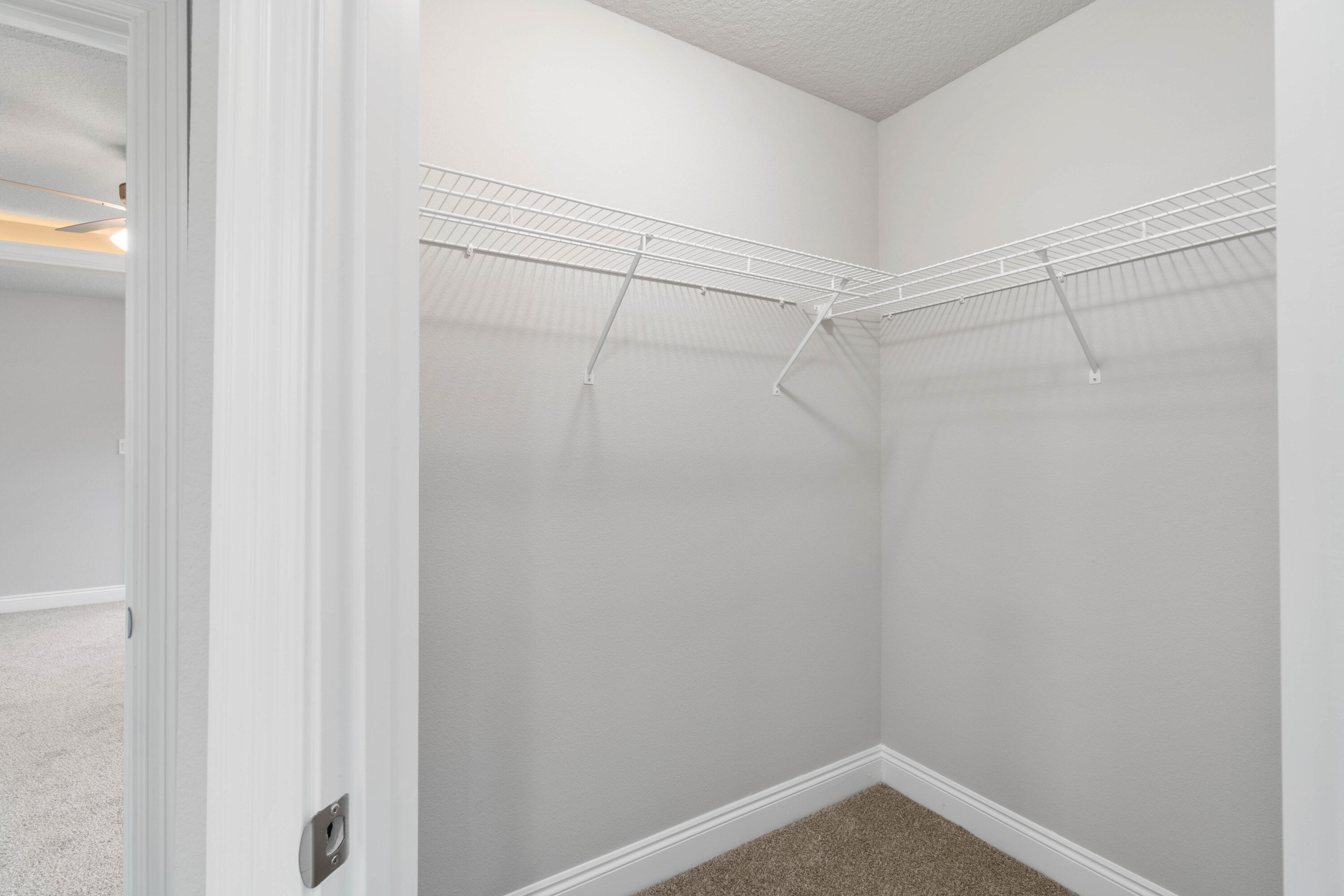 3548 Bob Tolbert Road Navarre, FL 32566 - Photo 27 of 47 a view of a room with racks on the wall