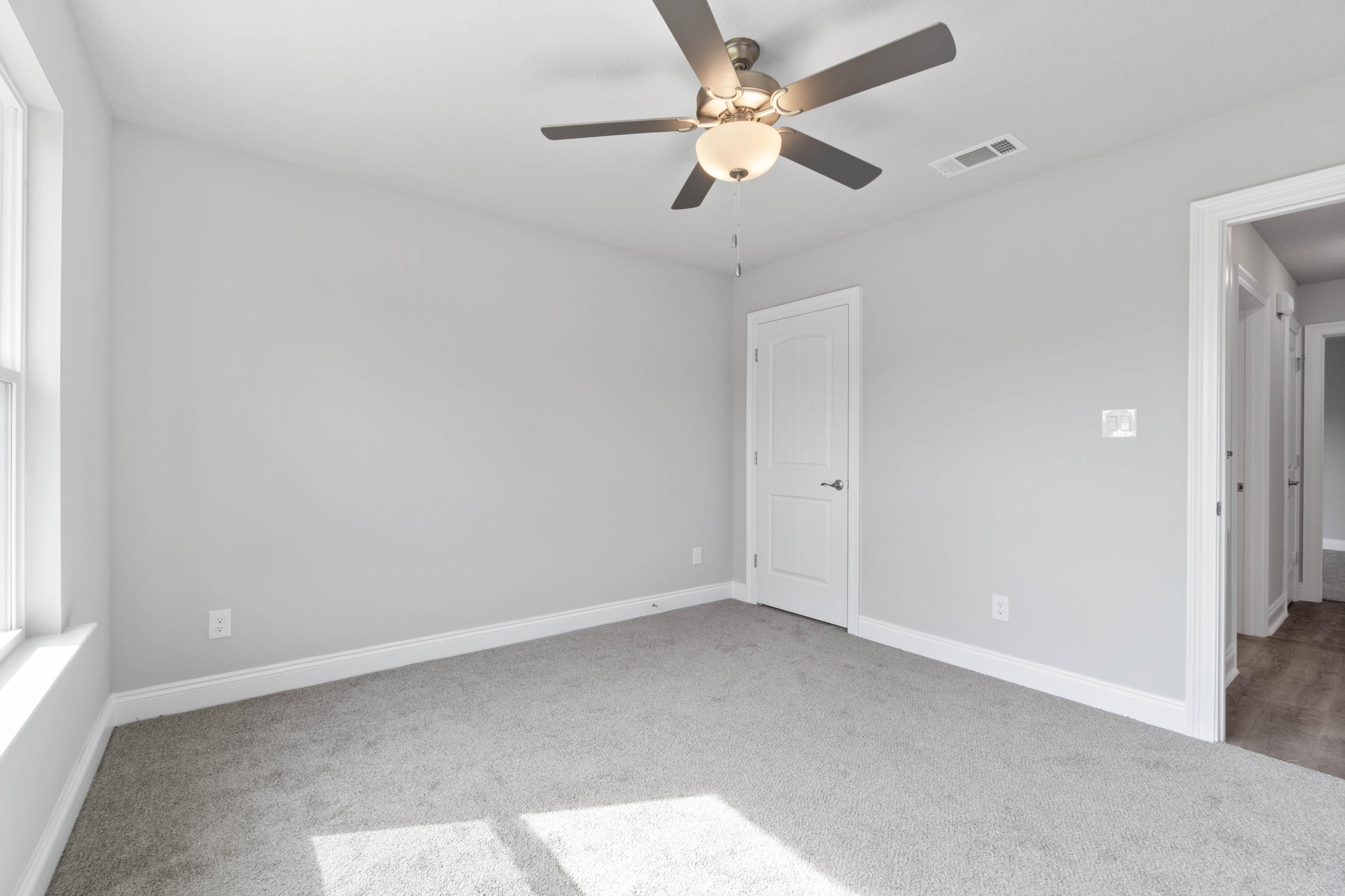 3548 Bob Tolbert Road Navarre, FL 32566 - Photo 38 of 47 an empty room with a window and a fan