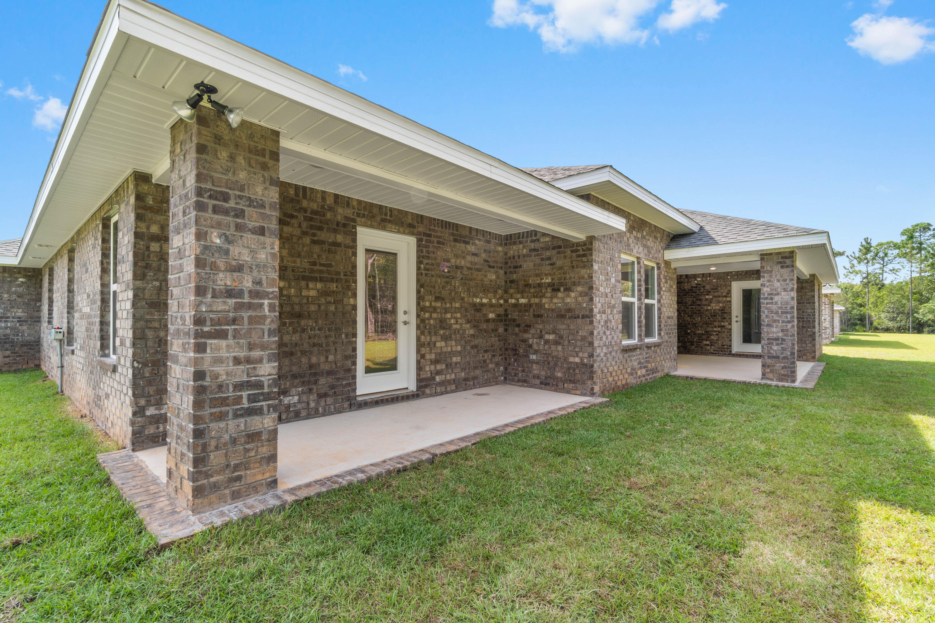3548 Bob Tolbert Road Navarre, FL 32566 - Photo 44 of 47 a front view of a house with a yard