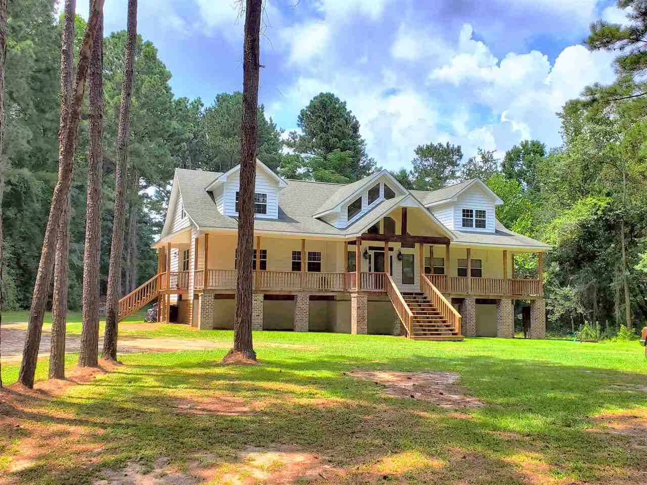 3182 Ellis Road Metter, GA 30439 - Photo 1 of 1 a view of a house with a swimming pool