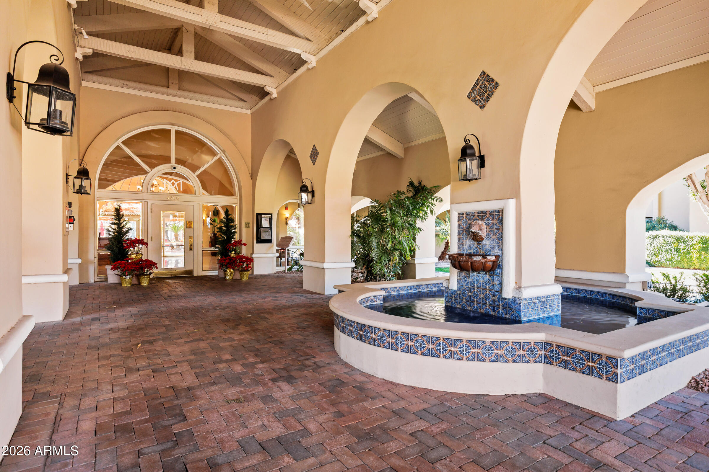 4200 North Miller Road, Unit 321 Scottsdale, AZ 85251 - Photo 16 of 41 a living room with furniture and a large window