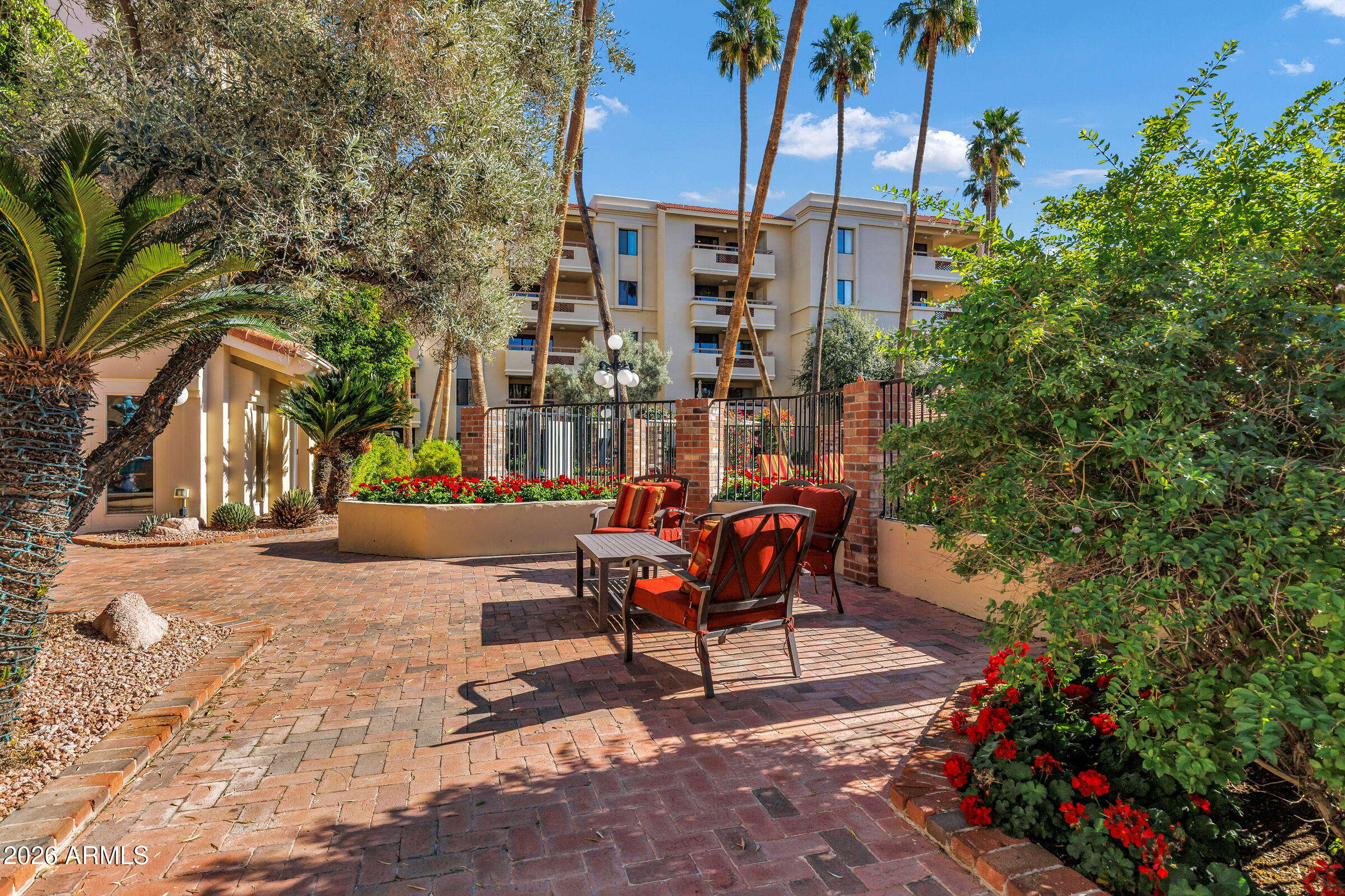 4200 North Miller Road, Unit 321 Scottsdale, AZ 85251 - Photo 5 of 41 a view of a bench sitting in back yard of a building
