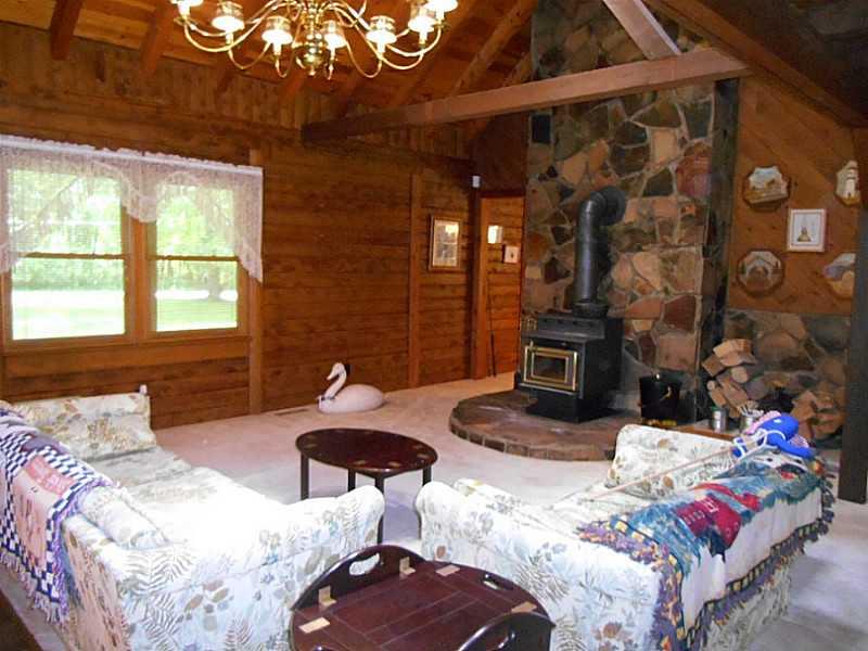 6183 Scott Road Jamestown, PA 16134 - Photo 2 of 25 Living Room. Beautiful Living Room with Exposed Beams and Wood Burning Fireplace