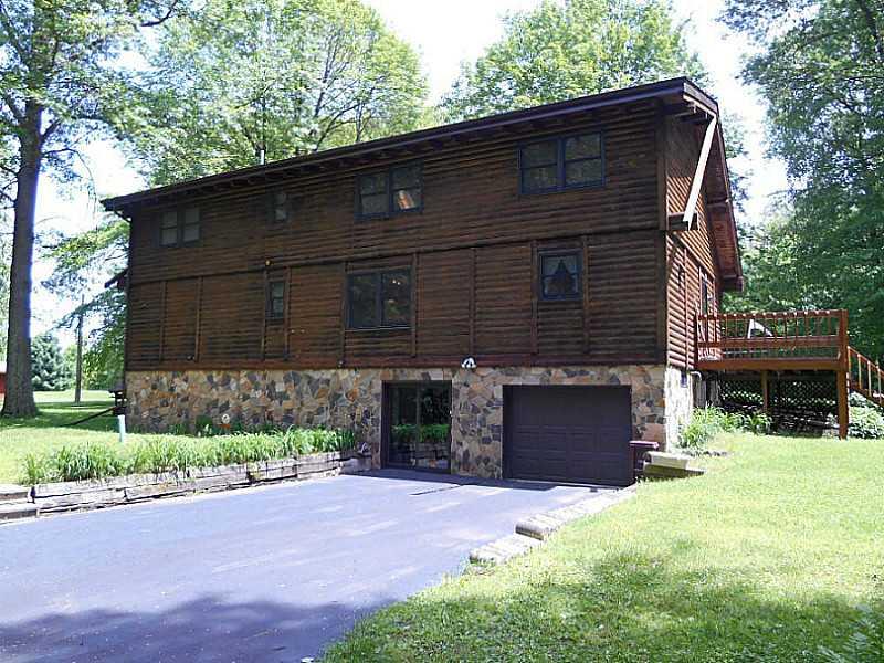 6183 Scott Road Jamestown, PA 16134 - Photo 20 of 25 Exterior Back. Integral Garage and Sliding Glass Doors to Lower Level Family Room.
