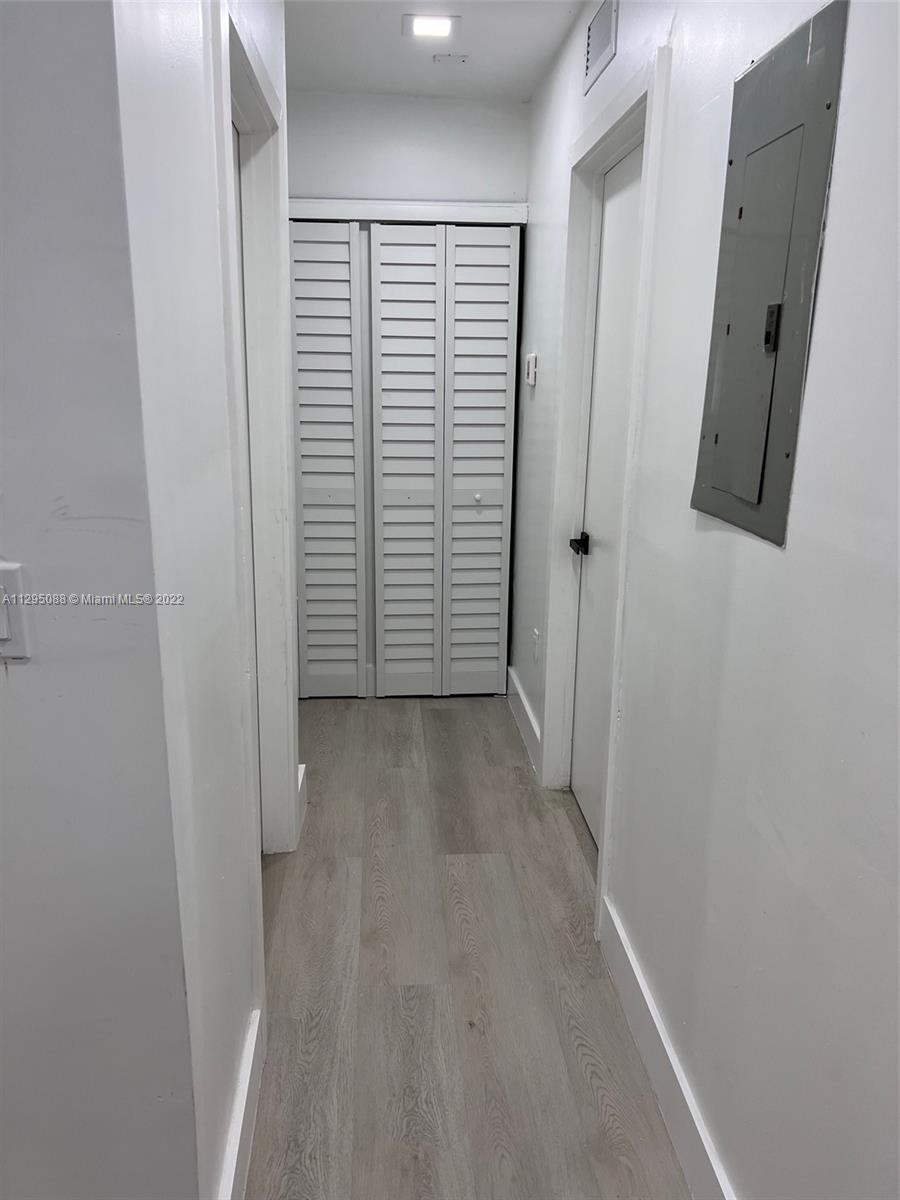 Brownsville Miami, FL 33142 - Photo 11 of 33 a view of a closet area with hardwood floor