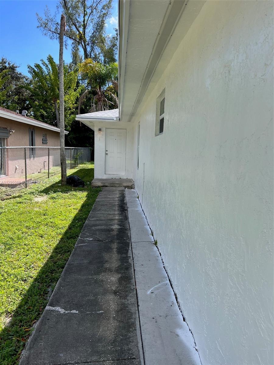 Brownsville Miami, FL 33142 - Photo 2 of 33 a front view of a house with a yard