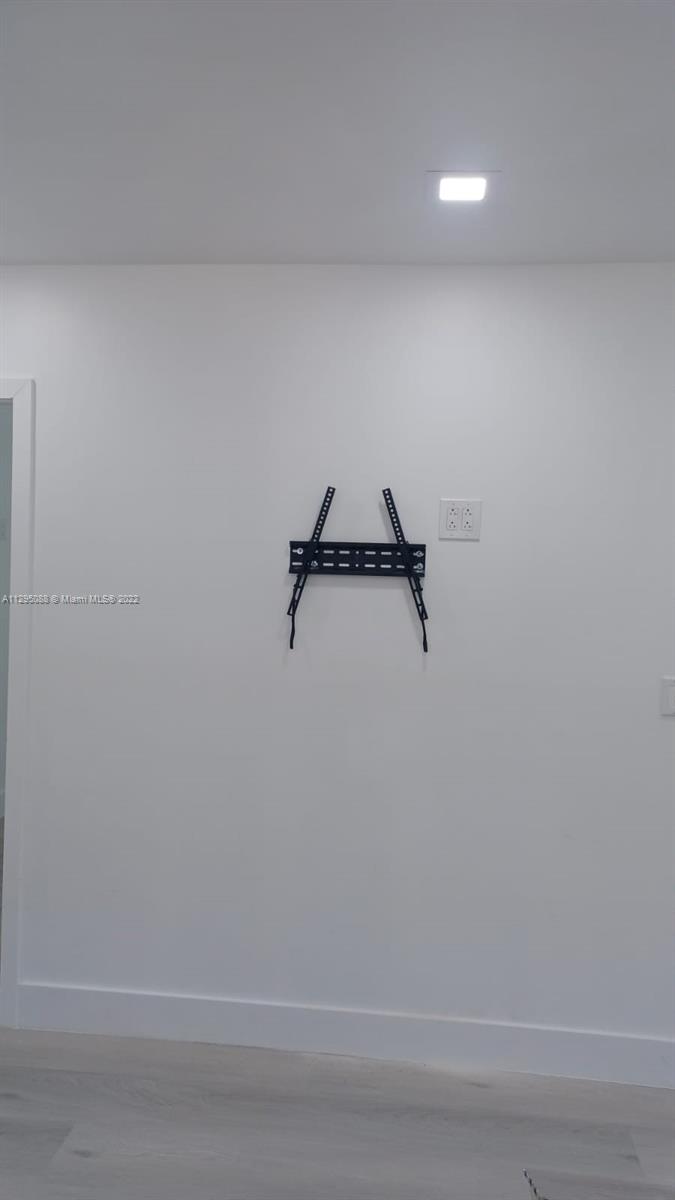 Brownsville Miami, FL 33142 - Photo 29 of 33 a view of a room with racks on the wall