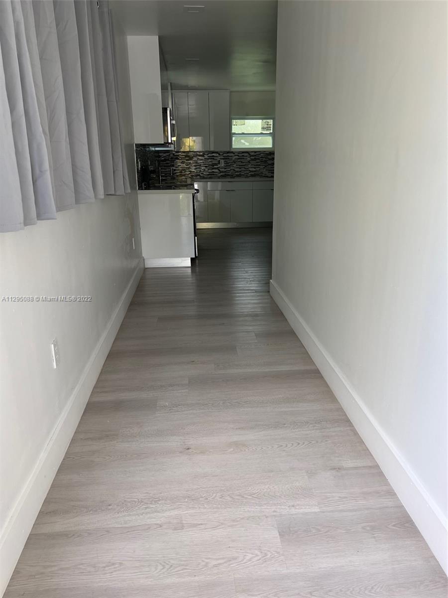 Brownsville Miami, FL 33142 - Photo 3 of 33 a view of a kitchen from the hallway