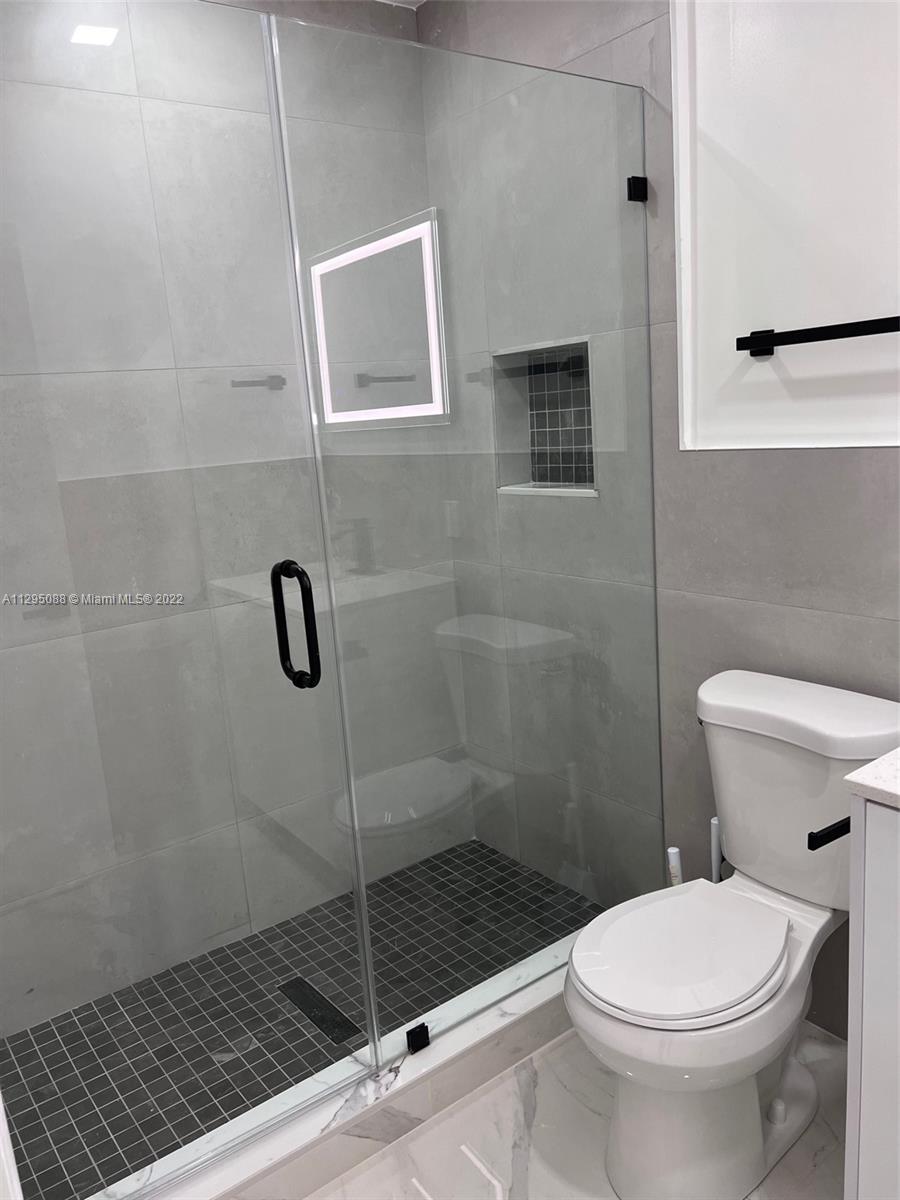 Brownsville Miami, FL 33142 - Photo 10 of 33 a bathroom with a toilet and a shower