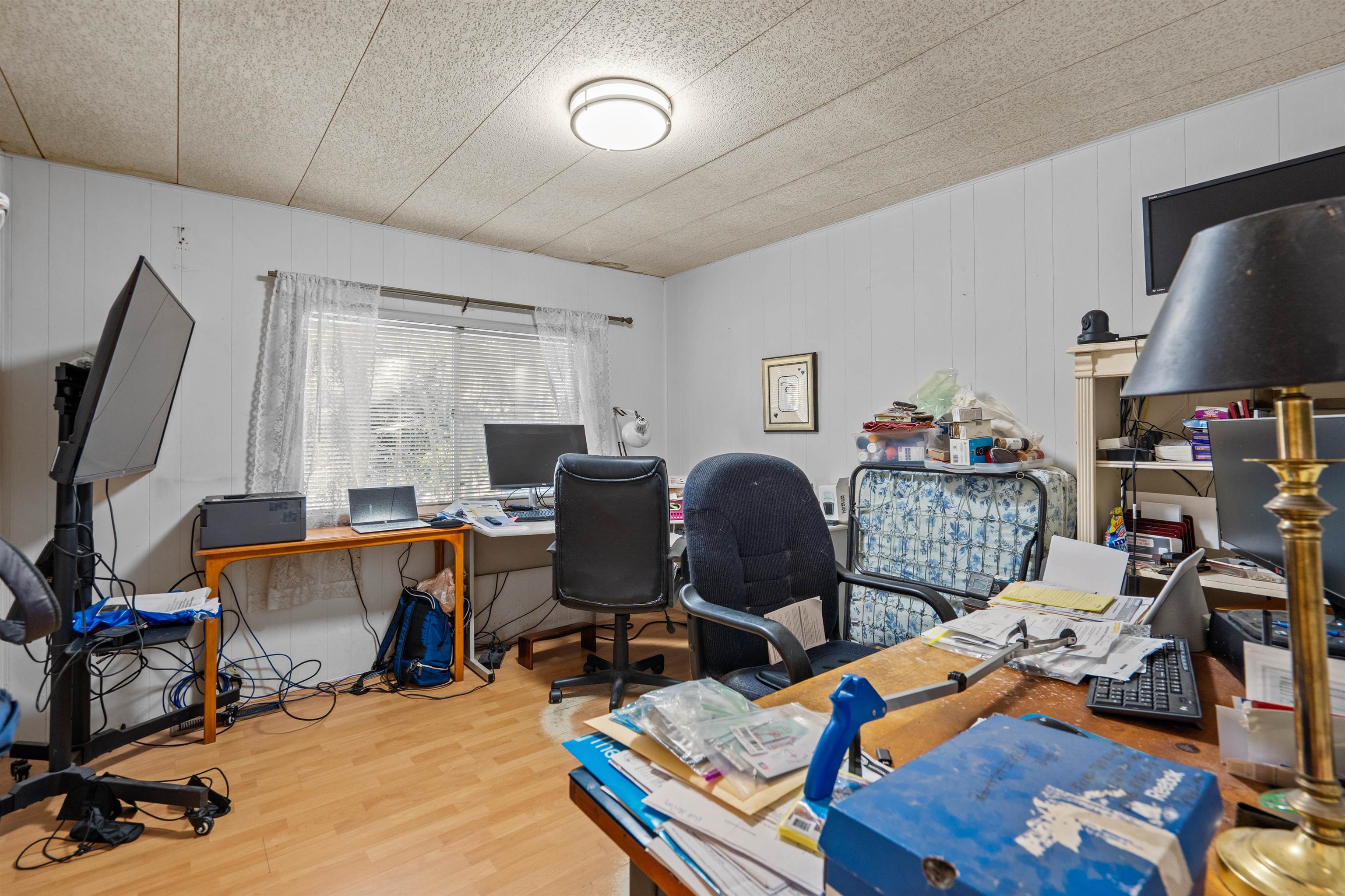 3979 Oak Terrace Road St. Augustine, FL 32086 - Photo 19 of 36 a view of a workspace with furniture and a window