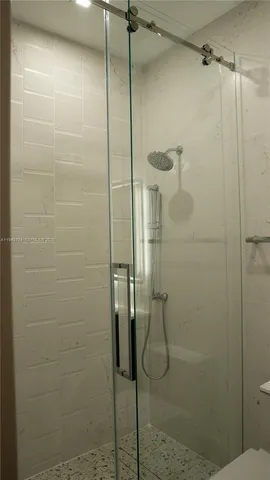 a bathroom with a sink toilet and mirror