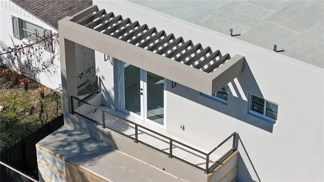 a view of backyard with a swimming pool and outdoor seating