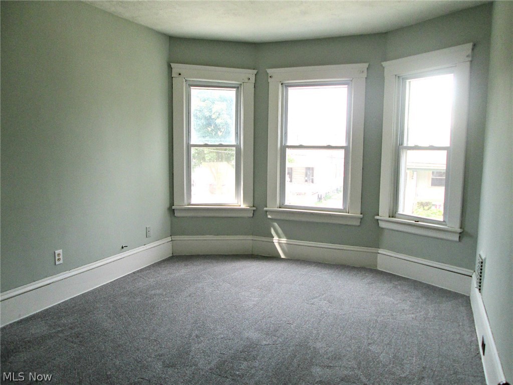 3717 Riverside Avenue Cleveland, OH 44109 - Photo 10 of 21 Neutral colors in the first front bedroom, brand new carpet and bay windows (in both front bedrooms)