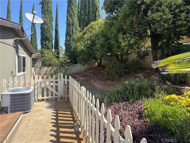 a view of a house with a small yard