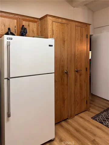 a white refrigerator freezer sitting in a kitchen