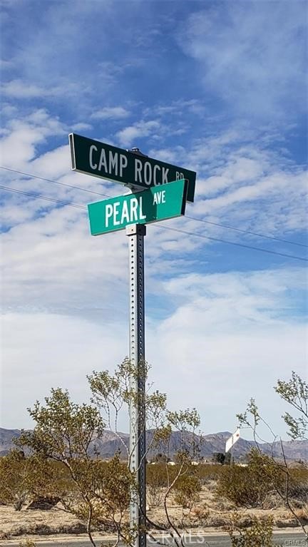 37051 Pearl Road Lucerne Valley, CA 92356 - Photo 4 of 7 a street sign sitting on top of a road