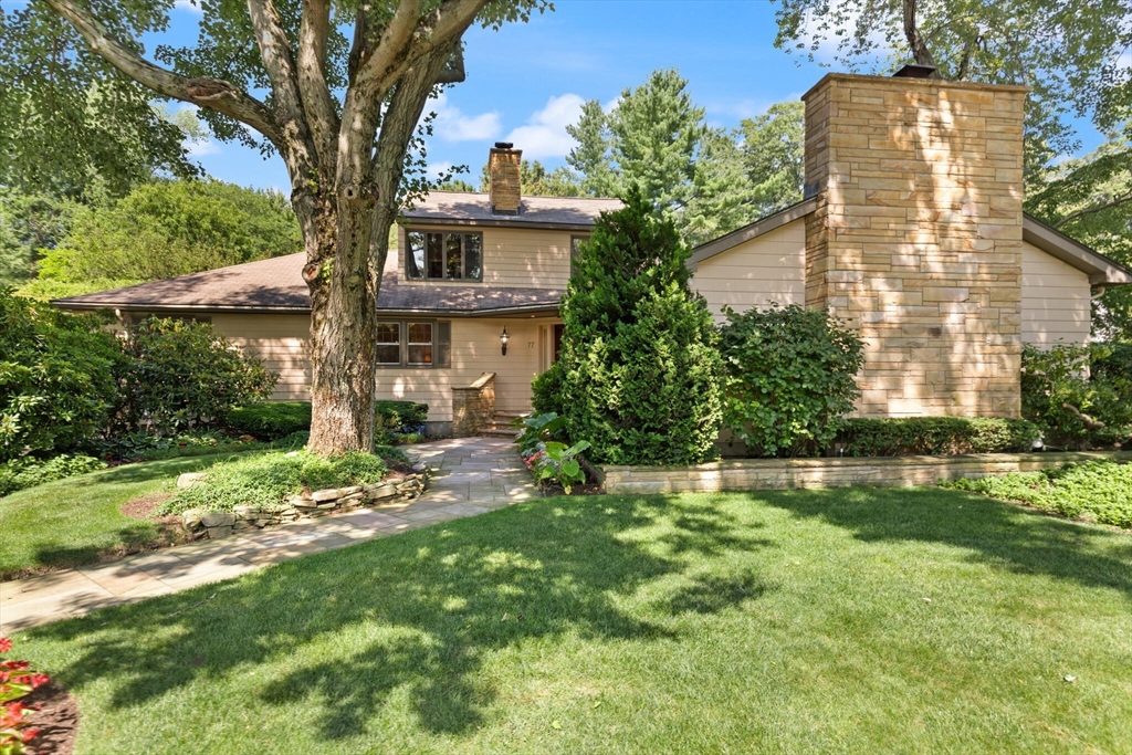 77 Wellesley Road Belmont, MA 02478 - Photo 1 of 31 a front view of a house with a yard