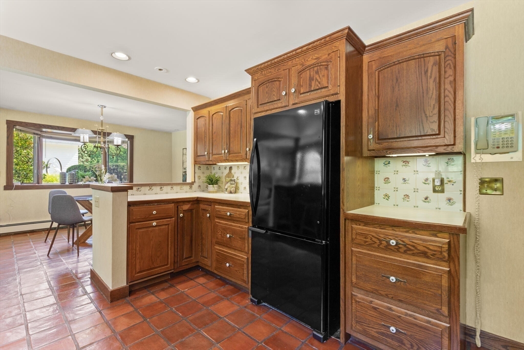 77 Wellesley Road Belmont, MA 02478 - Photo 14 of 31 a kitchen with granite countertop a refrigerator and furniture