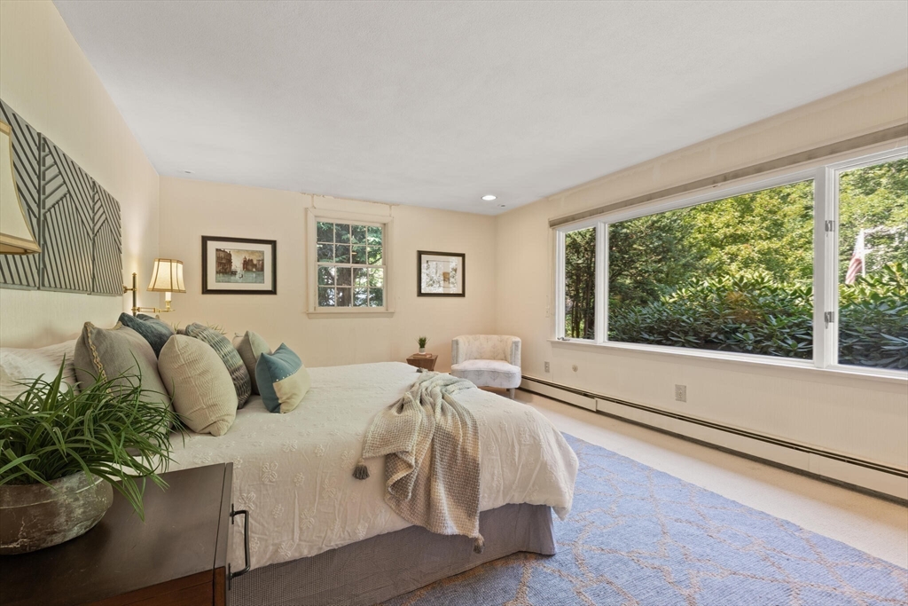 77 Wellesley Road Belmont, MA 02478 - Photo 17 of 31 a bed room with a bed and a large window