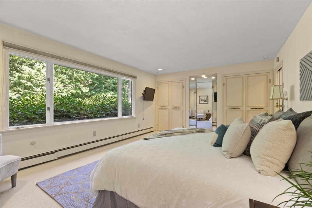 77 Wellesley Road Belmont, MA 02478 - Photo 18 of 31 a bedroom with a bed and a large window