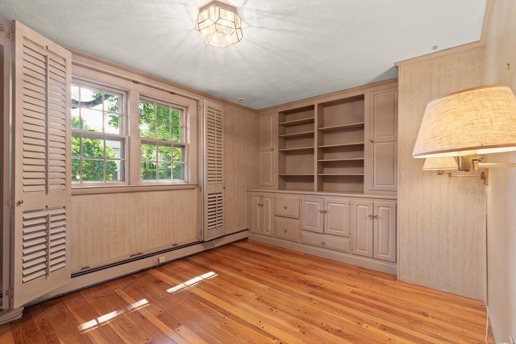 77 Wellesley Road Belmont, MA 02478 - Photo 22 of 31 wooden floor in an empty room with a window