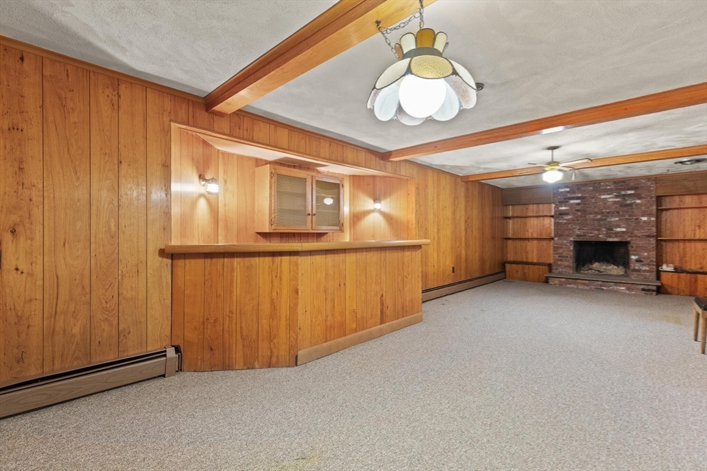 77 Wellesley Road Belmont, MA 02478 - Photo 27 of 31 a view of a room with wooden floor and a kitchen