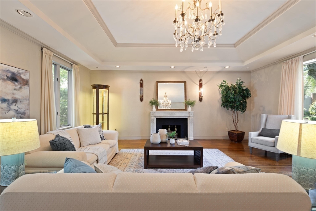 77 Wellesley Road Belmont, MA 02478 - Photo 6 of 31 a living room with furniture or chandelier and a fireplace