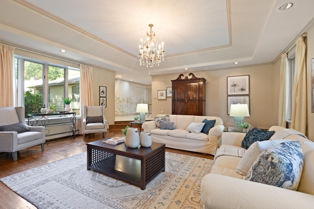 77 Wellesley Road Belmont, MA 02478 - Photo 7 of 31 a living room with furniture or couches and a large window