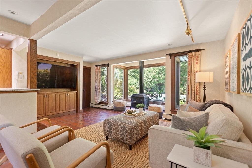 77 Wellesley Road Belmont, MA 02478 - Photo 8 of 31 a living room with furniture or outdoor view and a large window