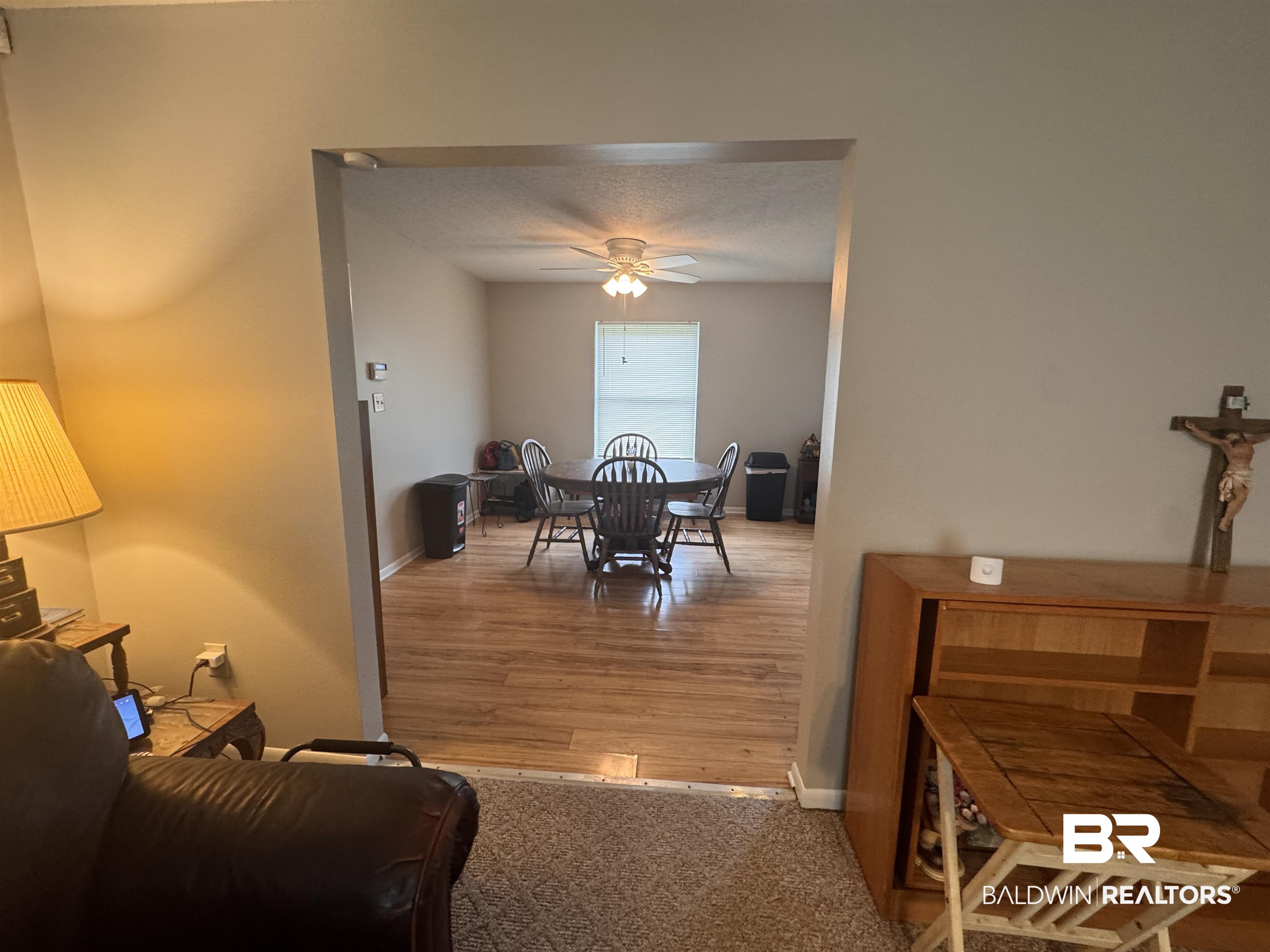 15148 Highland Circle Foley, AL 36535 - Photo 8 of 47 Dining room with ceiling fan, wood finished floors, and baseboards