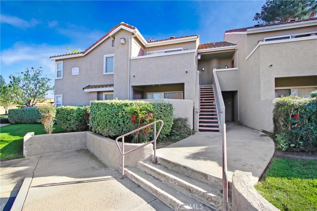 200 East Alessandro Boulevard, Unit 106 Riverside, CA 92508 - Photo 2 of 16 a front view of a house with porch
