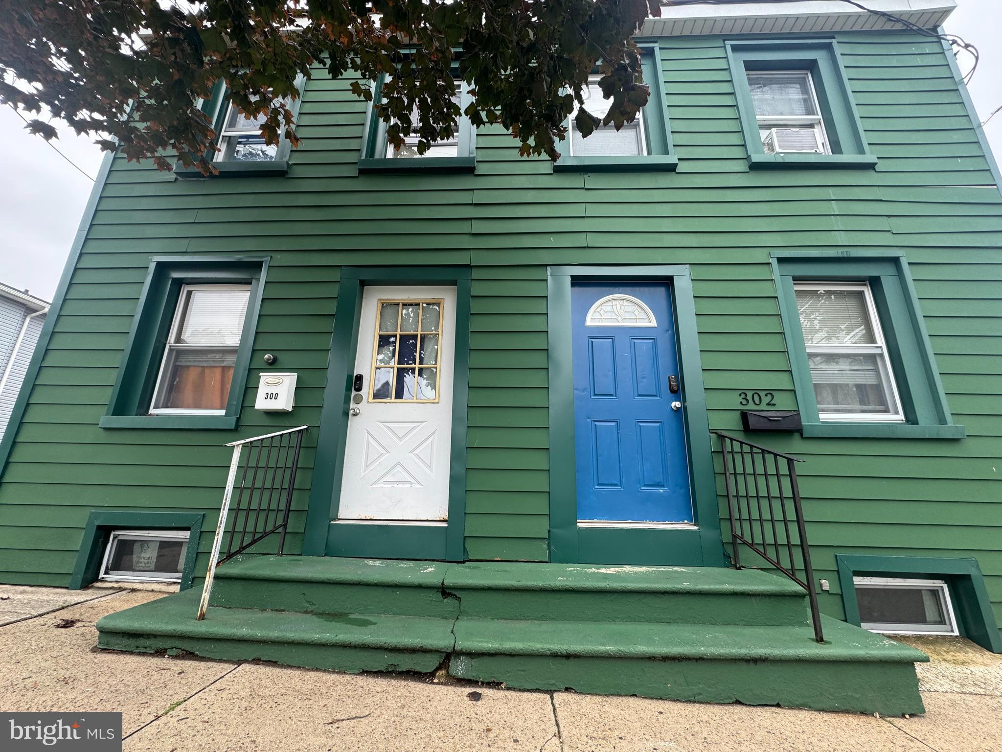 300-302 Madison Street Riverside, NJ 08075 - Photo 3 of 3 a view of a brick house with a small yard