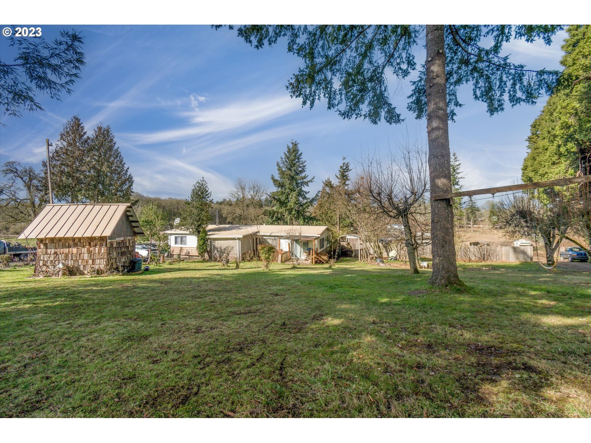 22345 Southwest Farmington Road Beaverton, OR 97007 - Photo 18 of 32 a view of a house with a yard