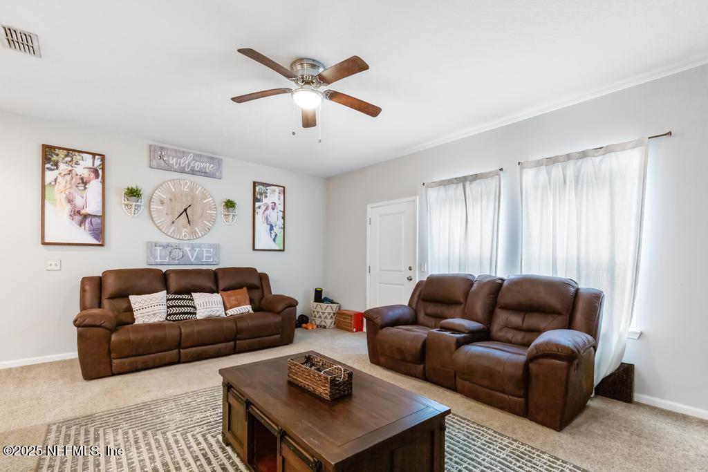 87267 Lents Road Yulee, FL 32097 - Photo 12 of 28 a living room with furniture and a window