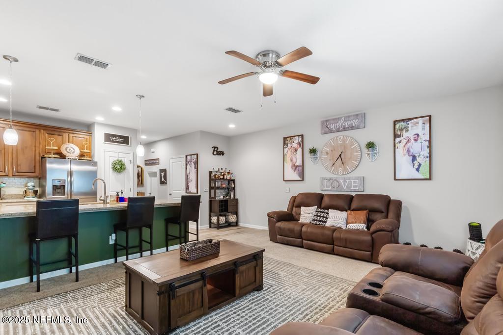 87267 Lents Road Yulee, FL 32097 - Photo 13 of 28 a living room with furniture and a large window
