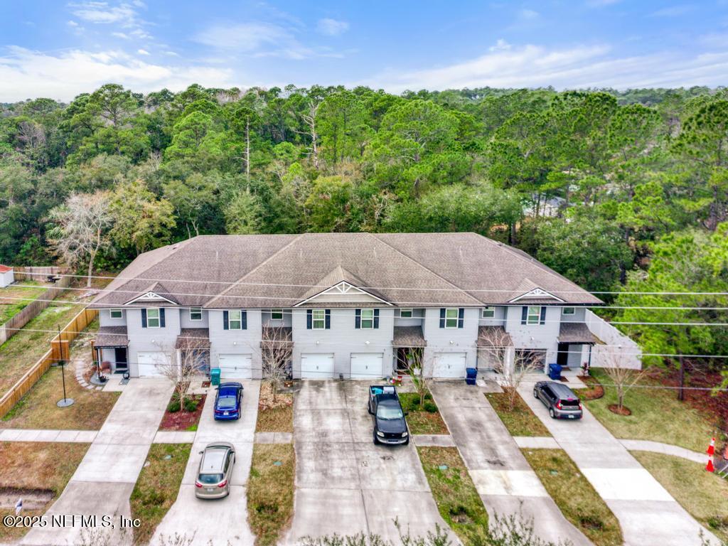 87267 Lents Road Yulee, FL 32097 - Photo 23 of 28 a view of a house with a yard