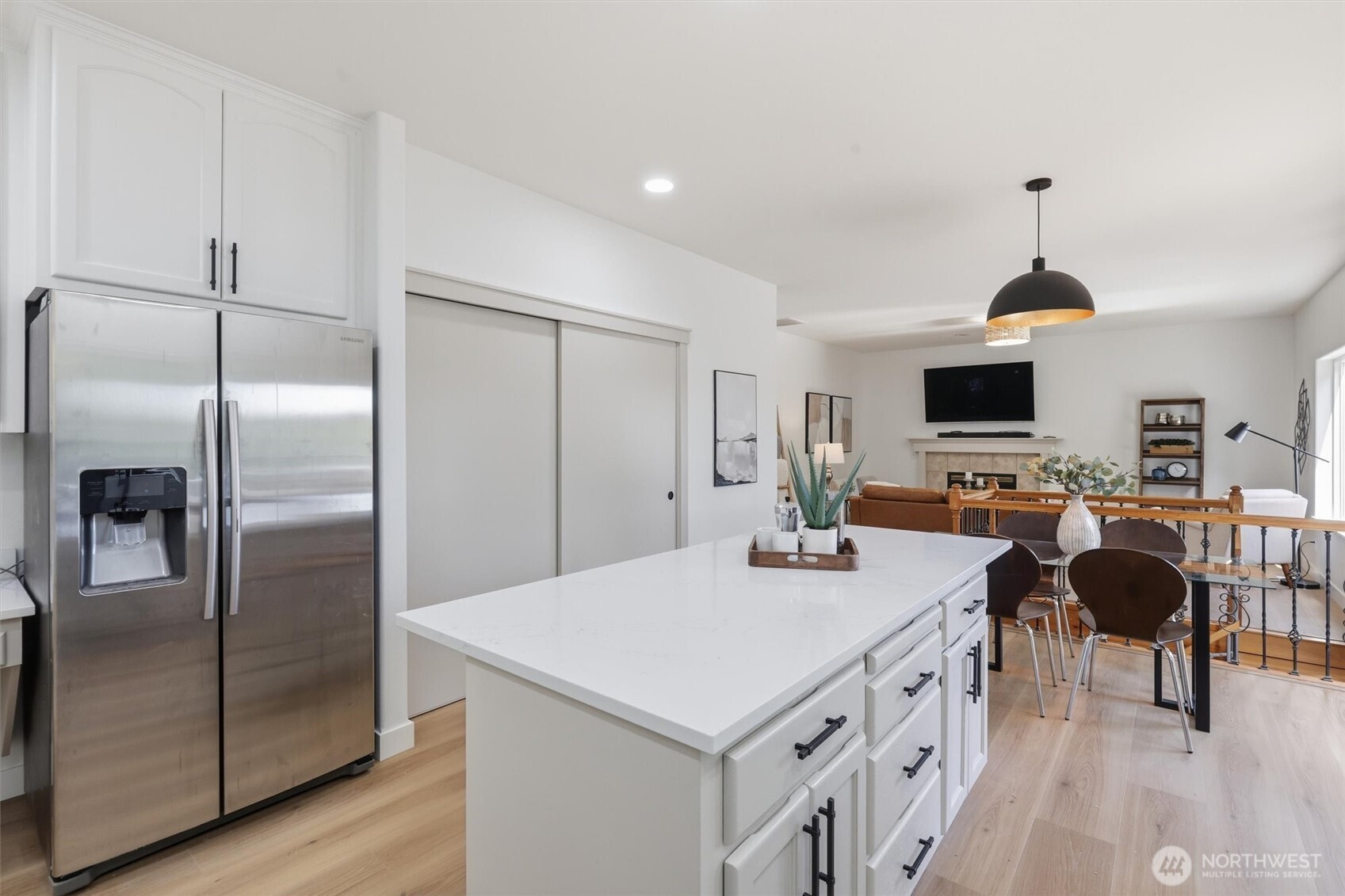 5523 East Wishon Road Snohomish, WA 98290 - Photo 14 of 39 a kitchen with stainless steel appliances a stove refrigerator sink dining table and chairs